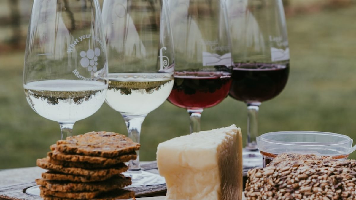 clear wine glass with red wine on table